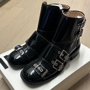 Ganni Shiny Black Moto Boots with Silver Buckles